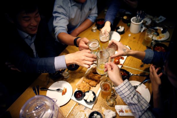 Young South Koreans dread revival of work dinners as pandemic eases