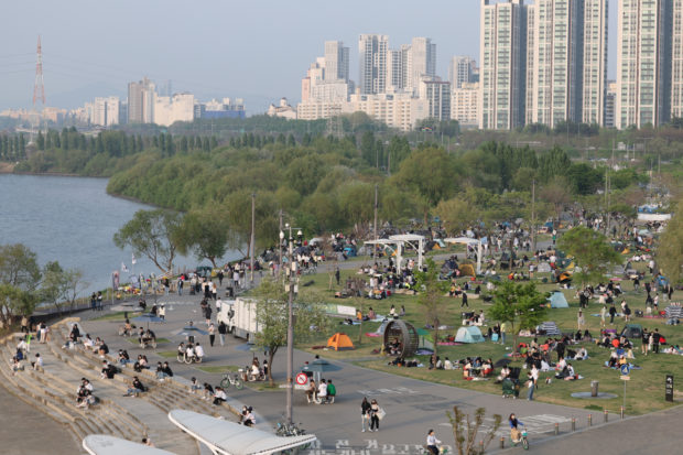 Picnickers crowd the riverside park in Seoul’s southwestern Banpo on Sunday