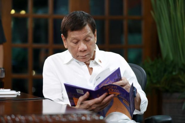 President Rodrigo Roa Duterte reading “Night Owl” written by Build, Build, Build committee chair Anna Mae Yu Lamentillo