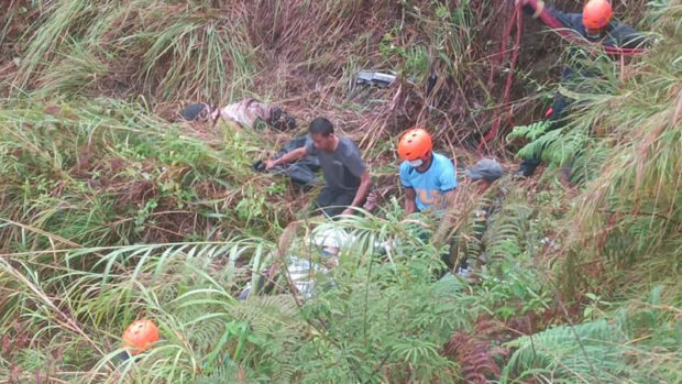 Rescuers carry the bodies of the victims in an ill-fated car in Besao town, Mountain Province on Thursday, April 21.(Besao MDRRMO)