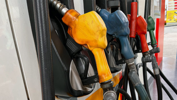 Fuel gas pumps. STORY: Oil companies roll back fuel pump prices