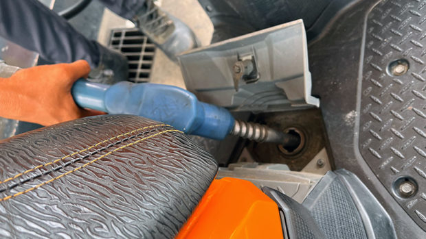 Fuel pump closeup. STORY: Fuel prices up anew; release of cash aid urged