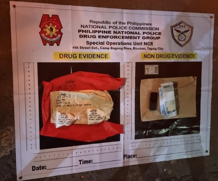 Police present money and a small packet containing crystal meth seized during a joint operation with PDEA in Tondo
