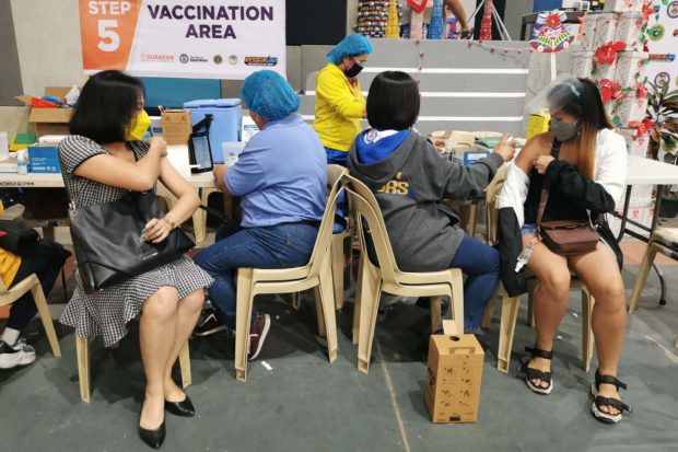 Unvaccinated Dagupan residents and those needing booster shots troop to the vaccination venue at the Dagupan City Astrodome