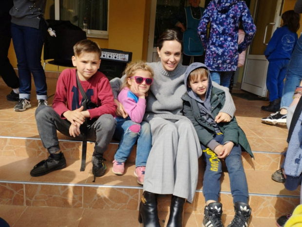U.S. actor and UNHCR Special Envoy Angelina Jolie poses for a picture with children, as Russia's attack on Ukraine continues, in Lviv, Ukraine April 30, 2022. Press Service of the Lviv Regional State Administration/Handout via REUTERS