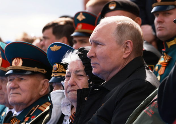 Russian President Vladimir Putin watches a military parade on Victory Day, which marks the 77th anniversary of the victory over Nazi Germany in World War Two, in Red Square in central Moscow, Russia May 9, 2022. Sputnik/Mikhail Metzel/Pool via REUTERS