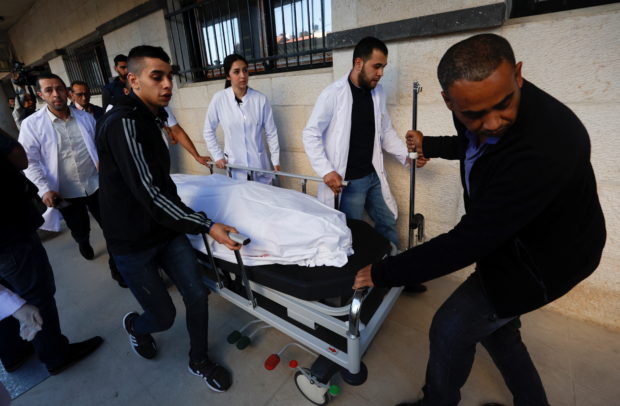 The body of Al Jazeera reporter Shireen Abu Akleh is carried on a stretcher at a hospital following an Israeli raid, in Jenin in the Israeli-occupied West Bank May 11, 2022. REUTERS/Mohamad Torokman
