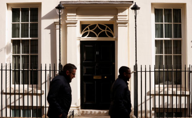 FILE PHOTO: People walk past 11 Downing Street, the official residence of British Chancellor of the Exchequer Rishi Sunak, in London, Britain April 11, 2022. REUTERS/John Sibley
