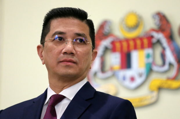 Malaysia's Minister of International Trade and Industry Azmin Ali reacts during a news conference in Putrajaya, Malaysia March 11, 2020. REUTERS/Lim Huey Teng/File Photo