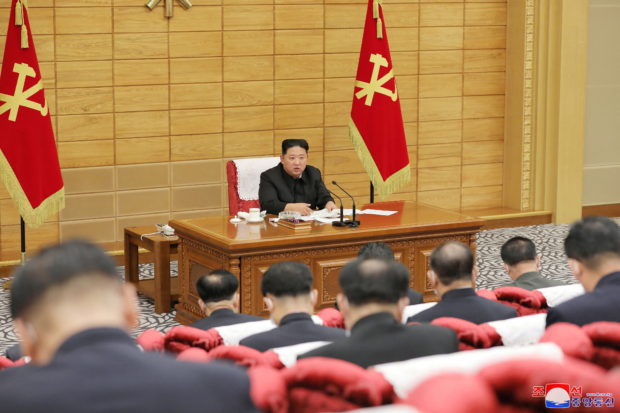 North Korean leader Kim Jong Un speaks at a politburo meeting of the ruling Workers' Party to inspect the country's antivirus efforts against the coronavirus disease (COVID-19) pandemic in this undated photo released by North Korea's Korean Central News Agency (KCNA) on May 14, 2022.  KCNA via REUTERS
