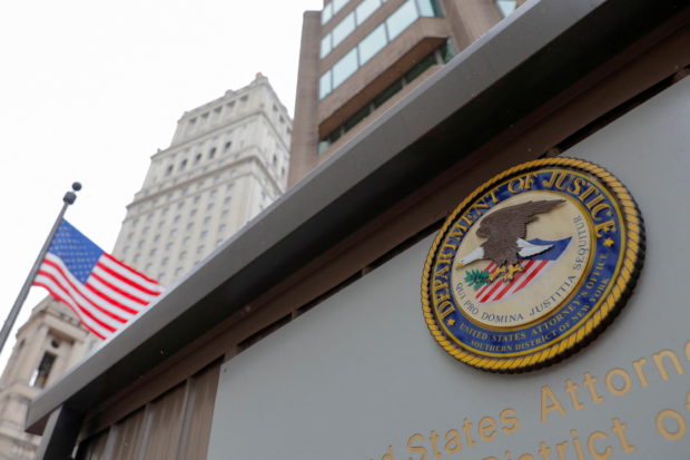 FILE PHOTO: The seal of the United States Department of Justice is seen on the building exterior of the United States Attorney's Office of the Southern District of New York in Manhattan, New York City, U.S., August 17, 2020. REUTERS/Andrew Kelly/File Photo