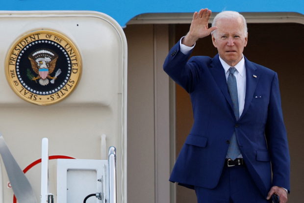 U.S. President Joe Biden gestures as he boards Air Force One to depart from Yokota Air Base in Fussa, on the outskirts of Tokyo, Japan May 24, 2022. REUTERS/Kim Kyung-Hoon