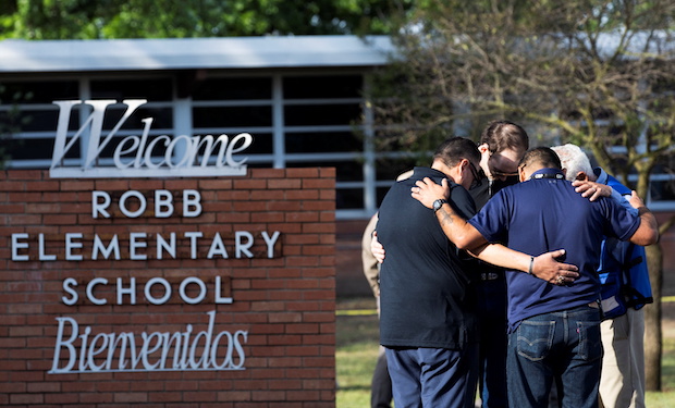 People react after a mass shooting at Robb Elementary School in Uvalde. STORY: Kids, teachers in Texas school shooting died in single classroom
