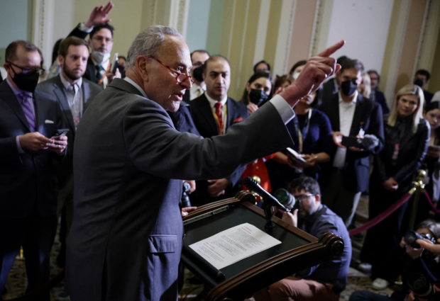 FILE PHOTO: Senate Majority Leader Chuck Schumer (D-NY) answers questions during the weekly Democratic news conference at the United States Capitol building in Washington, U.S., May 24, 2022. REUTERS/Evelyn Hockstein