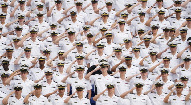 Underclass midshipmen salute during the national anthem at the U.S. Naval Academy graduation and commissioning ceremony in Annapolis, Maryland, U.S., May 27, 2022.  REUTERS/Kevin Lamarque