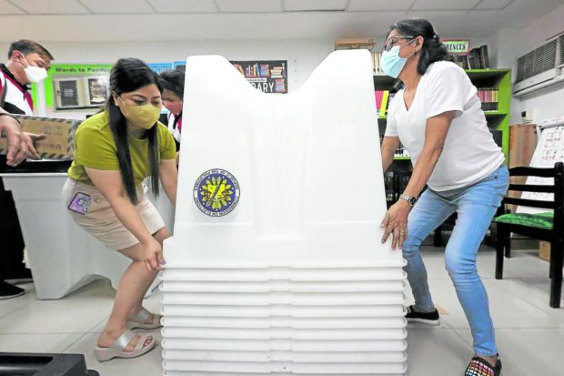 Teachers at Apolonio Samson Elementary School in Quezon City preparing for the May 9, 2022 elections. STORY: Exempt poll pay of teachers from tax, lawmakers urged