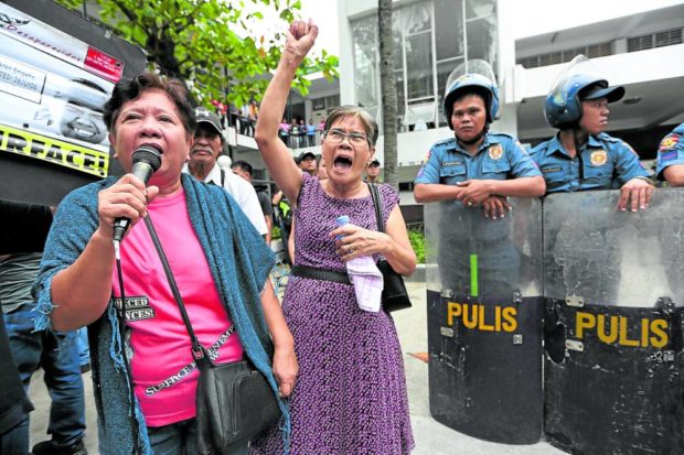 Concepcion Empeño (left) and Erlinda Cadapan, mothers of missing UP students Karen Empeño and Sherlyn Cadapan, speak to supporters outside the Malolos City courthouse on Sept. 17, 2018, the day former Maj. Gen. Jovito Palparan Jr. was found guilty of kidnapping. STORY: 2 hurting moms tell NTC: Sonshine abused franchise