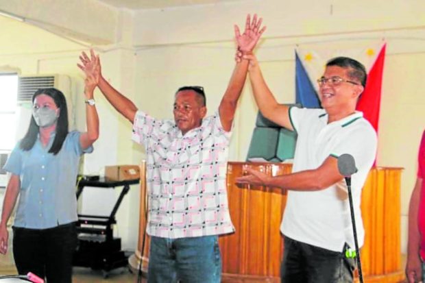  Rodrigo "Onoy" Rivera (center), a vegetable vendor, is proclaimed mayor of Dolores town, Eastern Samar