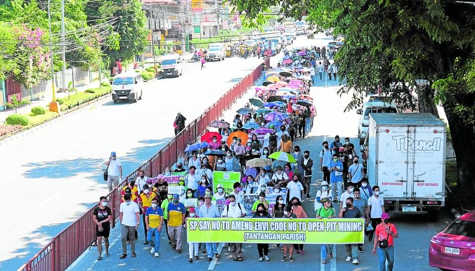 Members of religious and antimining groups join a solidarity march in Koronadal City on Thursday to protest the lifting of the ban on open-pit mining in South Cotabato environment code