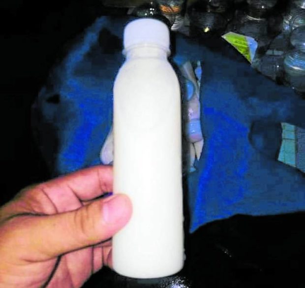 A sample of the bottled milk that elementary school students in Santa Catalina, Negros Oriental, drank before they turned ill on Thursday