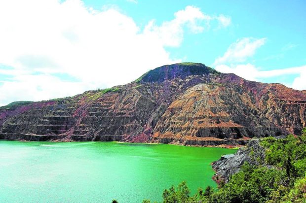 IRREVERSIBLE The mined Mt. Tapian and Marcopper open pit look refreshing in this Dec. 22, 2010, photo, but the damage wrought by the collapse of the firm’s siltation dam on the community on Dec. 6, 1993, was irreversible. —INQUIRER FILE PHOTO