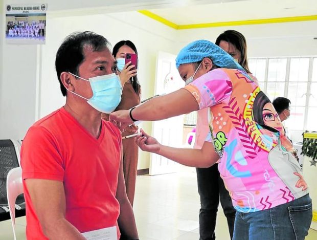 Mayor William Calvez of Trento, Agusan del Sur getting booster shot for COVID-19. STORY: Agusan town sets stringent rules for unvaccinated residents