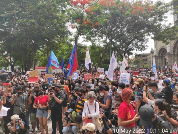 Around 400 people stage a protest near the main office of the Commission on Elections (Comelec) in Intramuros, Manila, on Tuesday, May 10, 2022. STORY: Expert expects COVID-19 surge due to election activities