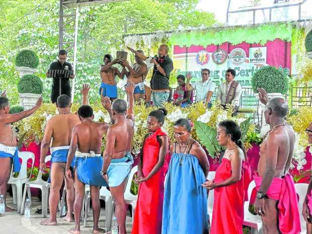 Aetas in Porac, Pampanga, wear their tribal attire “lubay” as they receive their certificate of ancestral domain title. STORY: After 13 years, Pampanga Aetas get title to ancestral domain