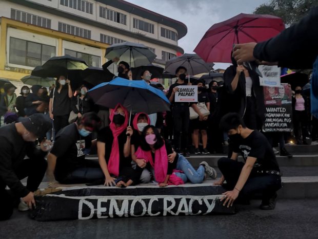 Baguio youth activists on Wednesday (May 11) stage a candlelight protest against alleged electoral fraud and the return of the Marcoses to Malacañang. STORY: Activists in Baguio protest vs return of Marcos to Malacañang
