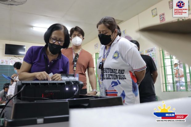 A poll precinct in San Marcelino town, Zambales conducts the final testing of a vote-counting machine days before the May 9 election