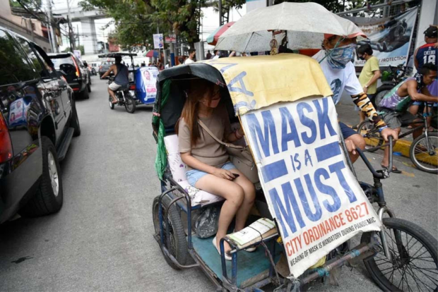 Pedicab with sign: MASK IS A MUST. STORY: OCTA projects 400 to 500 COVID cases by end of June