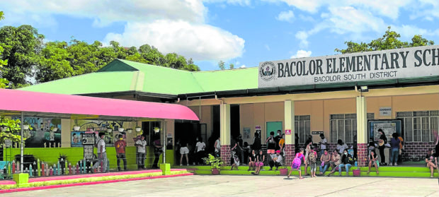 Residents of Bacolor, Pampanga, dispersed by Mt. Pinatubo’s eruption and lahar flow since 30 years ago return to their town to fulfill their civic duty and vote. STORY: Polls rouse Pampanga town buried by lahar