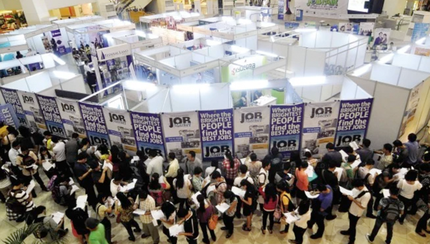 FILIPINOS in search of jobs flock to job fairs like this sponsored by the Philippine Daily Inquirer. FILE PHOTO