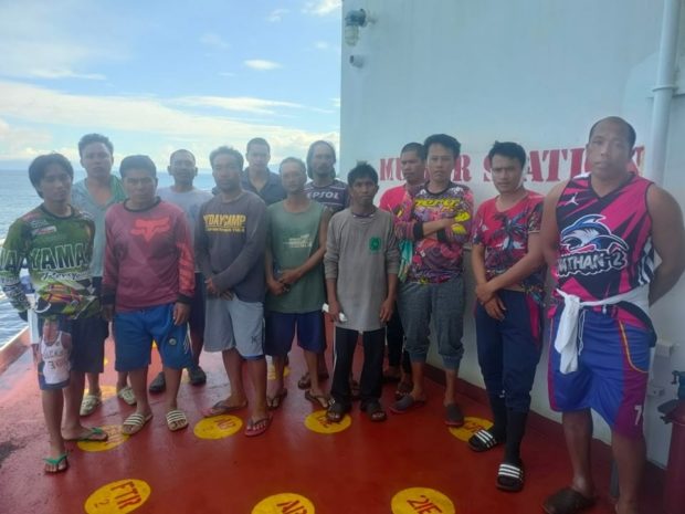 The 13 rescued crew members of Filipino fishing vessel FB JOT-18, which collided with cargo vessel MV Happy Hiro on May 28. Courtesy of PCG.