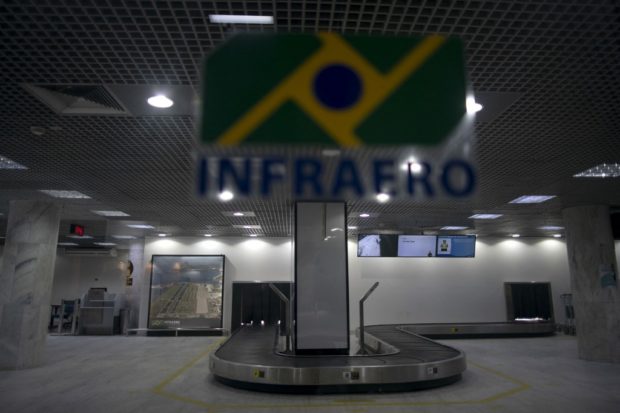 View of an empty baggage claim area of Santos Dumont airport in Rio de Janeiro, Brazil, on May 27, 2020, during the new coronavirus (COVID-19) outbreak. (Photo by Mauro Pimentel / AFP)