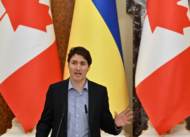  In this file photo taken on May 08, 2022 Canada's Prime Minister Justin Trudeau gestures during a joint press conference with Ukrainian President Volodymyr Zelensky in Kyiv amid the Russian invasion of Ukraine. - Prime Minister Justin Trudeau announced May 30, 2022 a proposed freeze on handgun ownership in Canada that would effectively ban their importation and sale, following recent mass shootings in the United States. The bill must still be passed by Parliament, with the ruling Liberals holding only a minority of seats. (Photo by Sergei SUPINSKY /