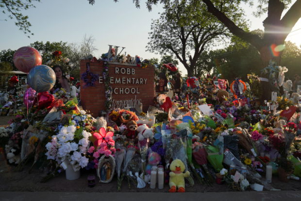 Flowers, toys, and other objects to remember the victims of the deadliest U.S. school shooting in nearly a decade resulting in the death of 19 children and two teachers, are seen at a memorial at Robb Elementary School in Uvalde, Texas, U.S. May 30, 2022. REUTERS/Veronica G. Cardenas
