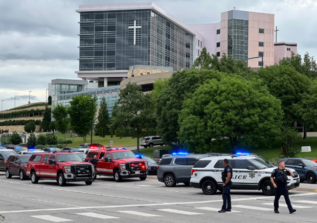 Emergency personnel work at the scene of a shooting at the Warren Clinic in Tulsa, Oklahoma, June 1, 2022.   REUTERS/Michael Noble Jr.