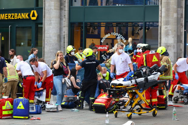 First responders assist the injured, after a car crashed into a group of people at Tauentzienstrasse in Berlin, Germany June 8, 2022. REUTERS/Fabrizio Bensch