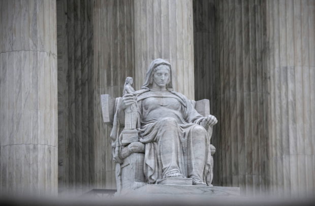 FILE PHOTO: The Contemplation of Justice statue is seen at the U.S. Supreme Court in Washington, U.S., May 3, 2022. REUTERS/Evelyn Hockstein/File Photo