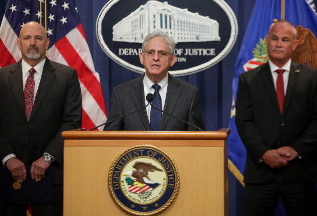 United States Attorney General Merrick Garland is joined by U.S. Attorney for the Northern District of Texas Chad Meacham and Jeff Boshek, Special Agent in Charge of the ATF’s Dallas Field Division, during a press conference announcing a significant firearms trafficking enforcement action and ongoing efforts to protect communities from violent crime and gun violence at the Department of Justice in Washington, U.S., June 13, 2022. REUTERS/Evelyn Hockstein