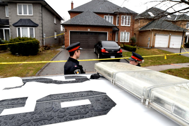 FILE PHOTO: Police officers wait for a search warrant in front of the home of Alek Minassian, in Richmond Hill, Ontario, Canada, April 25, 2018.   REUTERS/Saul Porto