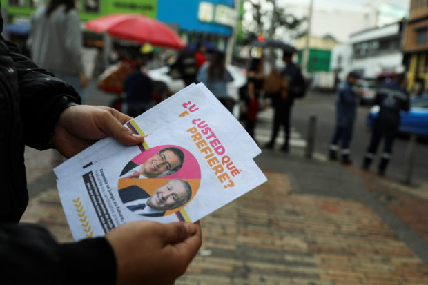 A flyer with the image of Colombian left-wing presidential candidate Gustavo Petro and Colombian centre-right presidential candidate Rodolfo Hernandez is pictured days before the second round of presidential election in Bogota, Colombia June 16, 2022. REUTERS/Luisa Gonzalez