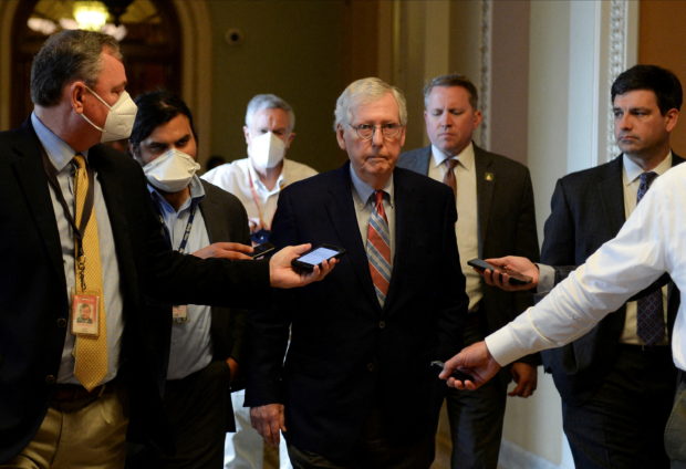 U.S. Senate Minority Leader Mitch McConnell (R-KY) is questioned by reporters at the U.S. Capitol in Washington, U.S., June 21, 2022 REUTERS/Mary F. Calvert