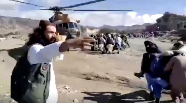 People carry injured to a helicopter following a massive earthquake, in Paktika Province, Afghanistan, June 22, 2022, in this screen grab taken from a video. BAKHTAR NEWS AGENCY/Handout via REUTERS