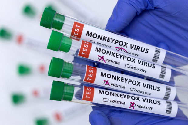 Test tubes labelled "Monkeypox virus positive and negative" are seen in this illustration taken May 23, 2022. REUTERS/Dado Ruvic/Illustration/File Photo