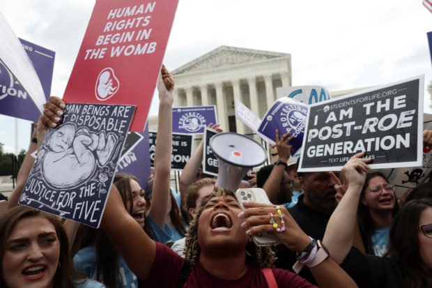 Anti-abortion demonstrators celebrate outside the United States Supreme Court as the court rules in the Dobbs v Women’s Health Organization abortion case, overturning the landmark Roe v Wade abortion decision in Washington, U.S., June 24, 2022. REUTERS/Evelyn Hockstein