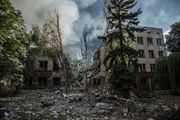 FILE PHOTO: A smoke rises over remains of a building destroyed by a military strike, as Russia's attack on Ukraine continues, in Lysychansk, Luhansk region, Ukraine June 17, 2022. REUTERS/Oleksandr Ratushniak