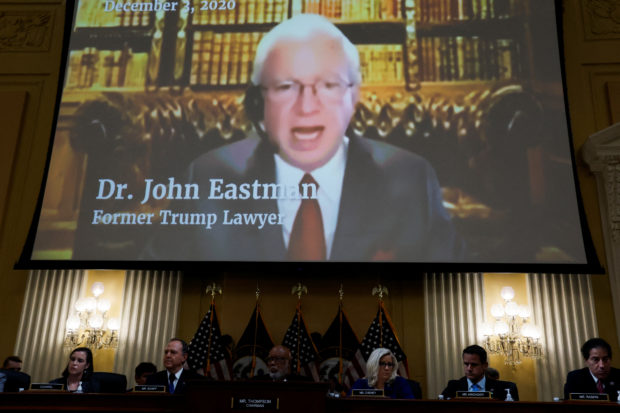 FILE PHOTO: John Eastman, former attorney for former U.S. President Donald Trump, is seen speaking in a video displayed above during the fourth of eight planned public hearings of the U.S. House Select Committee to investigate the January 6 Attack on the U.S. Capitol, on Capitol Hill in Washington, U.S. June 21, 2022. REUTERS/Jonathan Ernst
