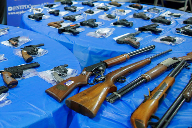 FILE PHOTO: Guns are displayed after a gun buyback event organized by the New York City Police Department (NYPD), in the Queens borough of New York City, U.S., June 12, 2021. REUTERS/Eduardo Munoz/File Photo